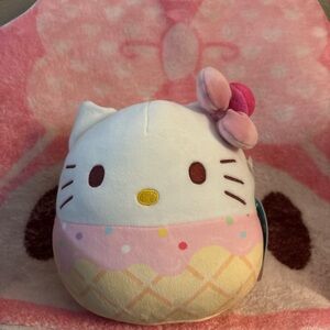 Hello Kitty Pink Ice Cream Squishmallow with pink bow and tag.